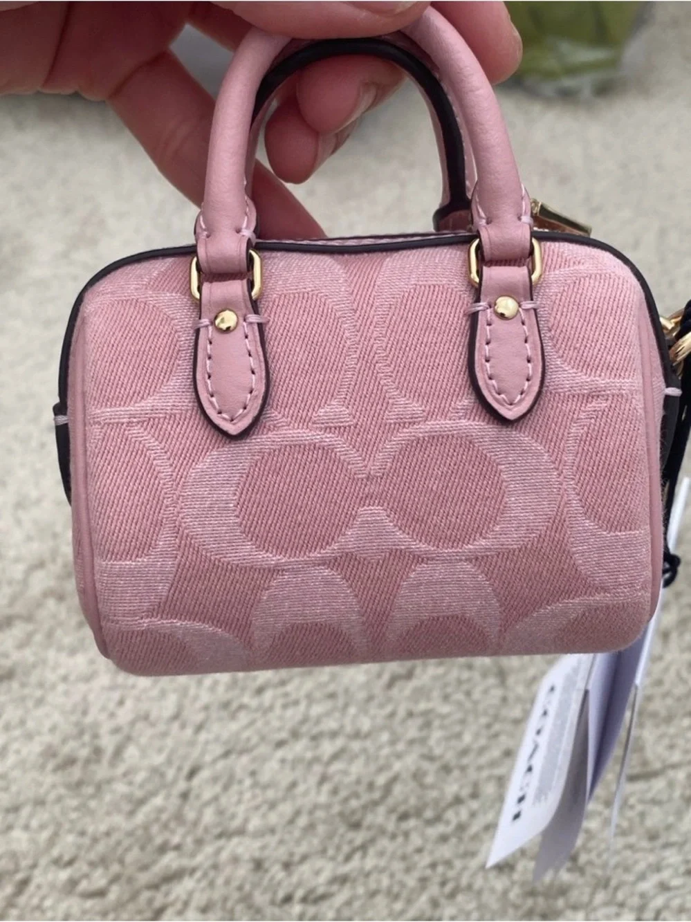 coach pink denim rowan charm